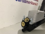 Variklio alyvos aušintuvas su filtru